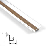 Close-up of medium brown wood-grain aluminum inside corner trim with silver edges and profile diagram