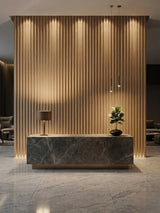Maple Slate WPC fluted panels creating an illuminated lobby reception wall