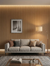 Maple Slate WPC fluted 3D wall panels behind a sofa in a warm living room
