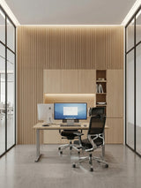 Maple Slate WPC fluted wall panels installed behind a modern office workstation