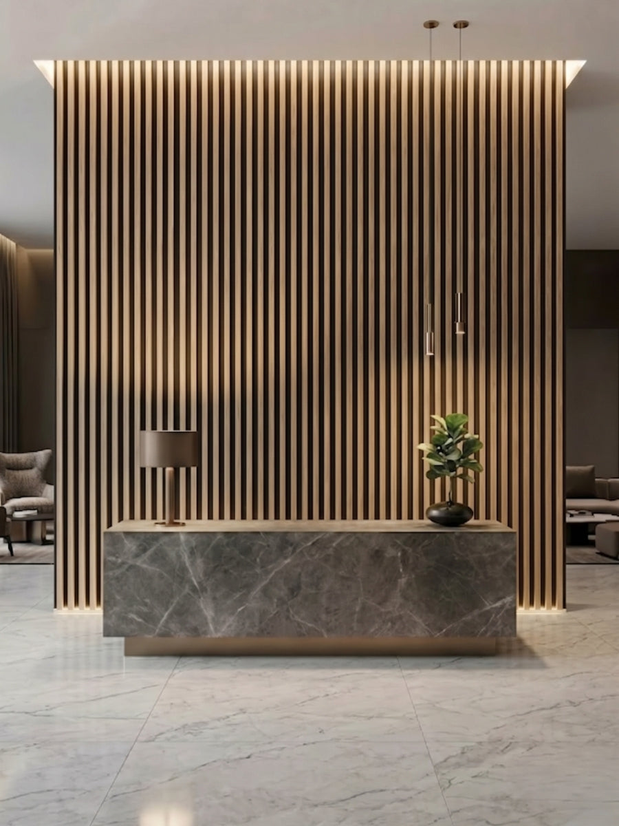 Floor-to-ceiling Maple Slate Black fluted wall panels behind a stone reception desk