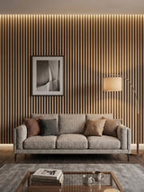 Maple Slate Black WPC fluted 3D wall panels installed behind a gray sofa in a modern living room