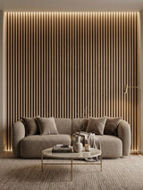 Illuminated Maple Slate Black fluted wall panels behind a curved sofa in a modern lounge