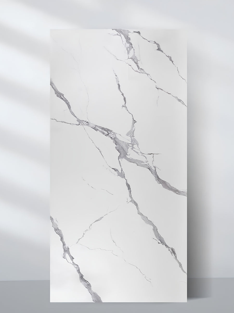 Matte Calacatta Belga 4 x 8 ft PVC marble wall panel with a white surface and sweeping gray veining