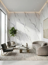 Modern living room with Matte Calacatta Belga PVC marble sheets covering the white and gray veined walls