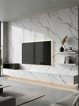 Matte Calacatta Belga PVC marble wall panels installed behind a mounted TV and floating media console