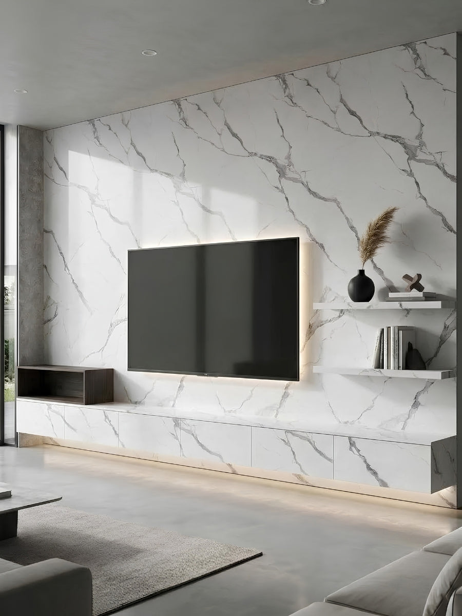 Matte Calacatta Belga PVC marble wall panels installed behind a mounted TV and floating media console