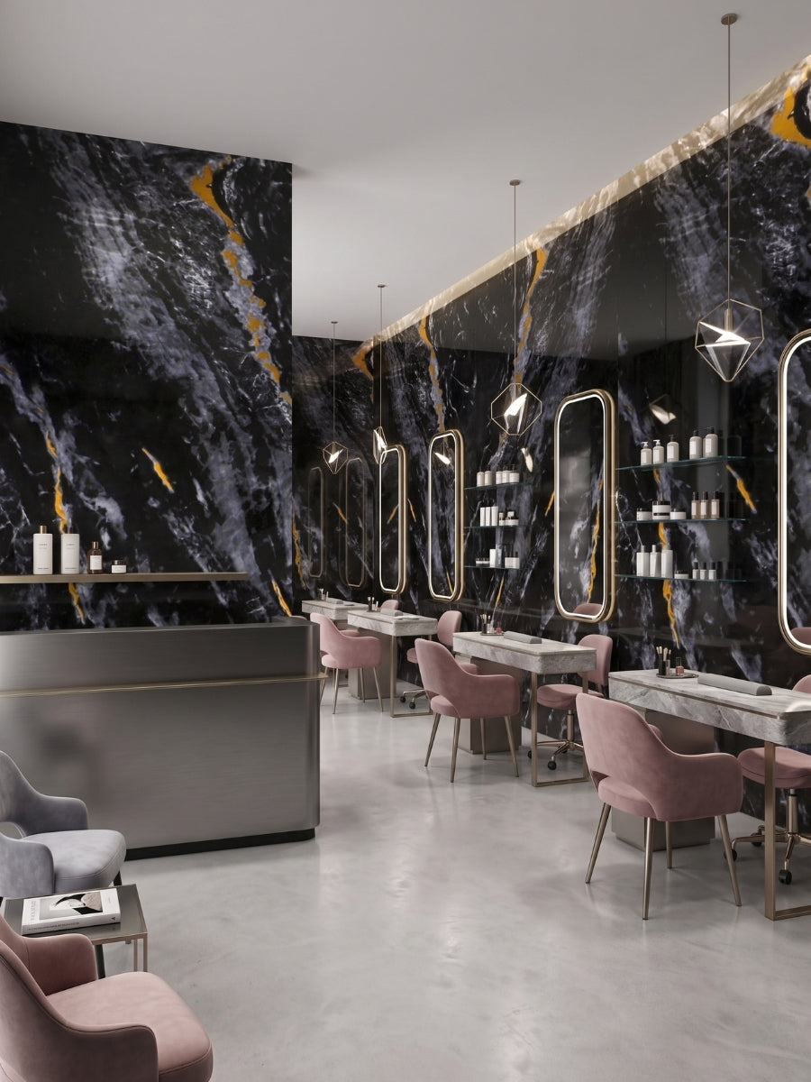 Midnight Gold Marble PVC wall panels lining a contemporary salon with illuminated mirrors and pink chairs