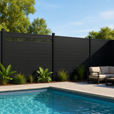 Modern decorative fence screen with vertical slats installed on a dark landscaped fence beside a swimming pool