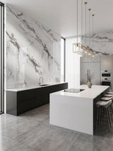Moonlit Vein marble-look PVC wall panels surrounding black cabinets in a bright modern kitchen