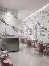 Moonlit Vein marble-look PVC panels covering salon walls behind mirrors, styling stations, and pink chairs