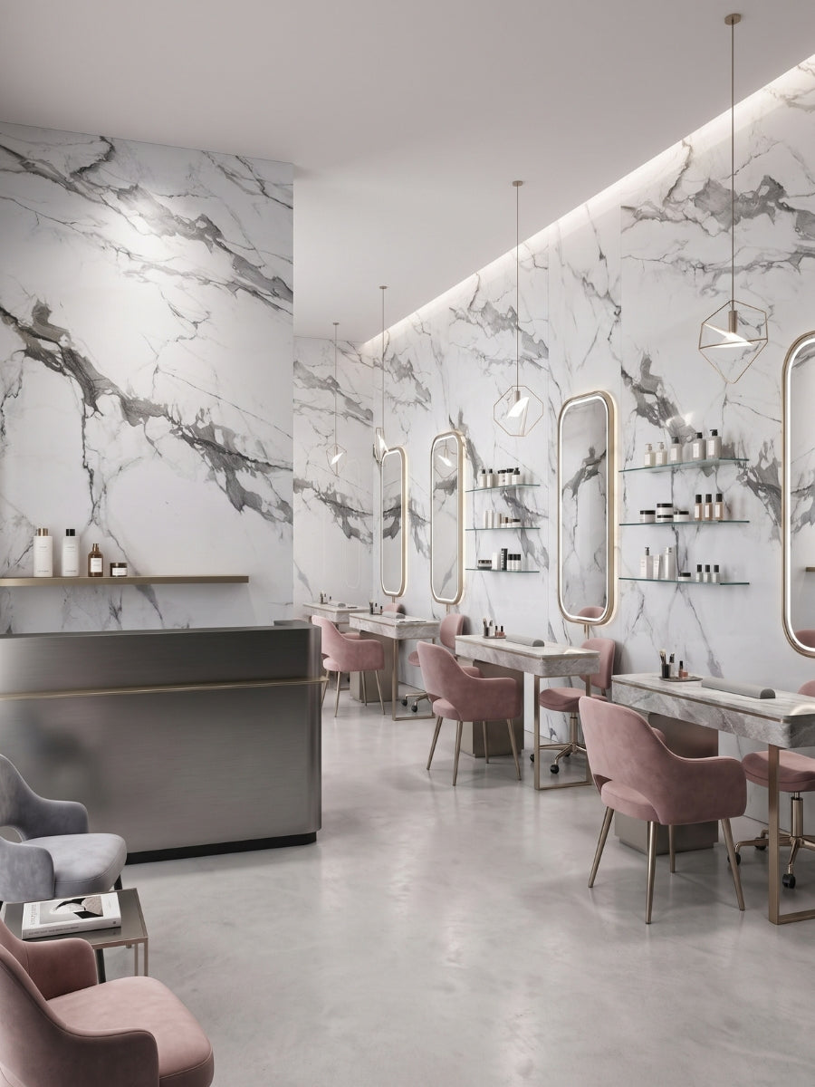 Moonlit Vein marble-look PVC panels covering salon walls behind mirrors, styling stations, and pink chairs