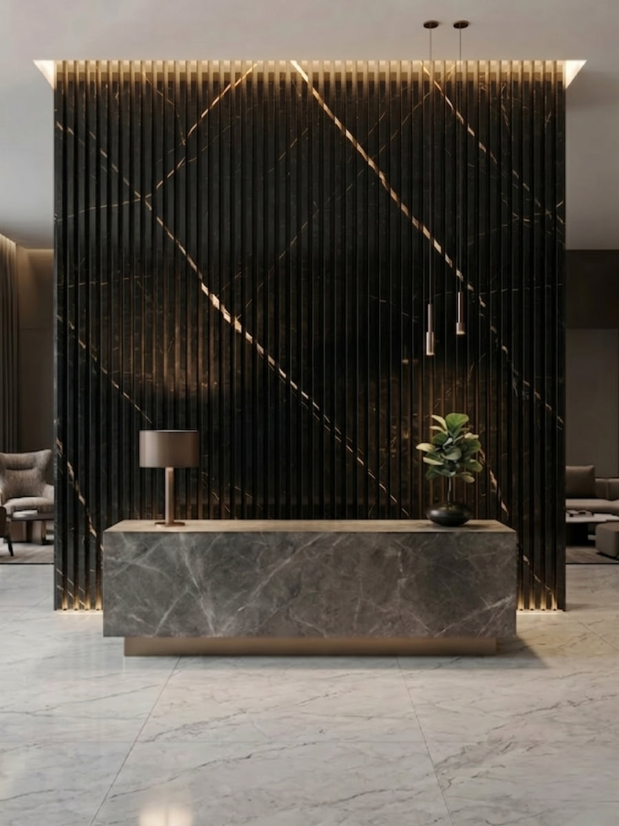 Noir Royale fluted wall panels forming a black and gold-toned backdrop for a reception desk