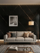Noir Royale WPC fluted 3D wall panels installed behind a gray sofa in a modern living room