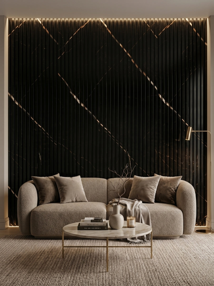 Black Noir Royale fluted wall panels with gold-toned diagonal veining behind a curved sofa