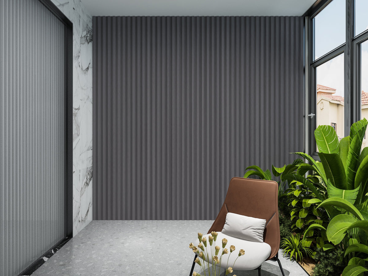 Oak Gray WPC fluted 3D wall panels on a sunroom accent wall beside plants and seating