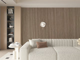Royal Oak bamboo veneer fluted panel installed as a full-height accent wall behind a curved sofa