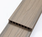 Brown composite deck board with antique wood grain texture