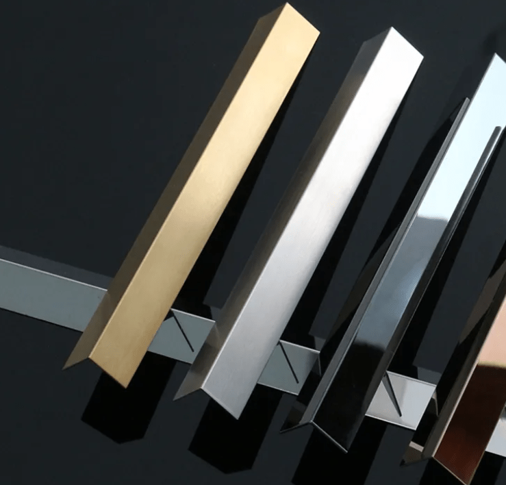 Metal edge strips with angled profiles in gold, silver, black, and bronze finishes