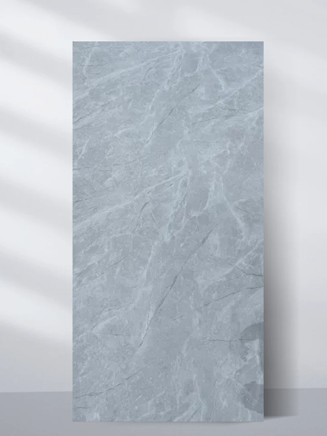 Pale blue-gray PVC marble sheet sample with subtle natural stone texture