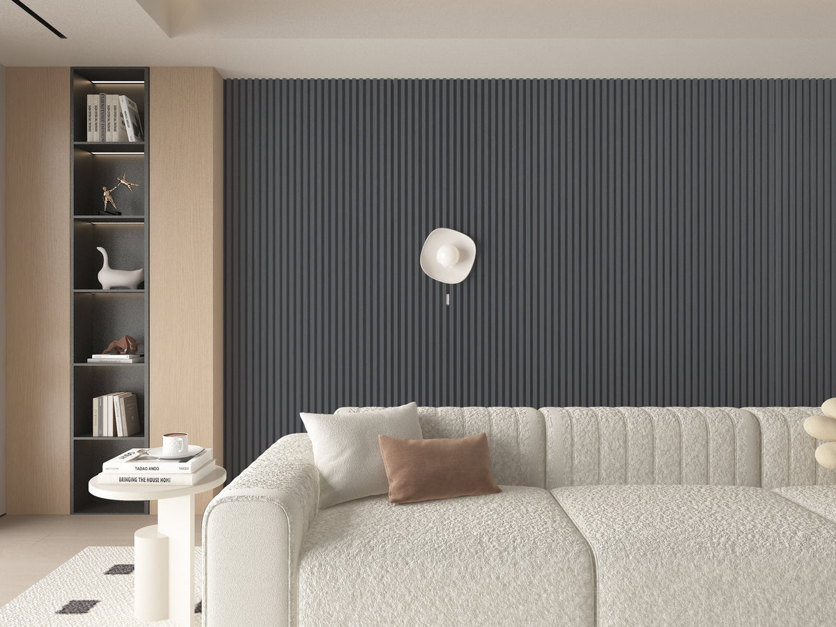 Floor-to-ceiling silver gray metallic WPC fluted 3D accent wall behind a curved sofa