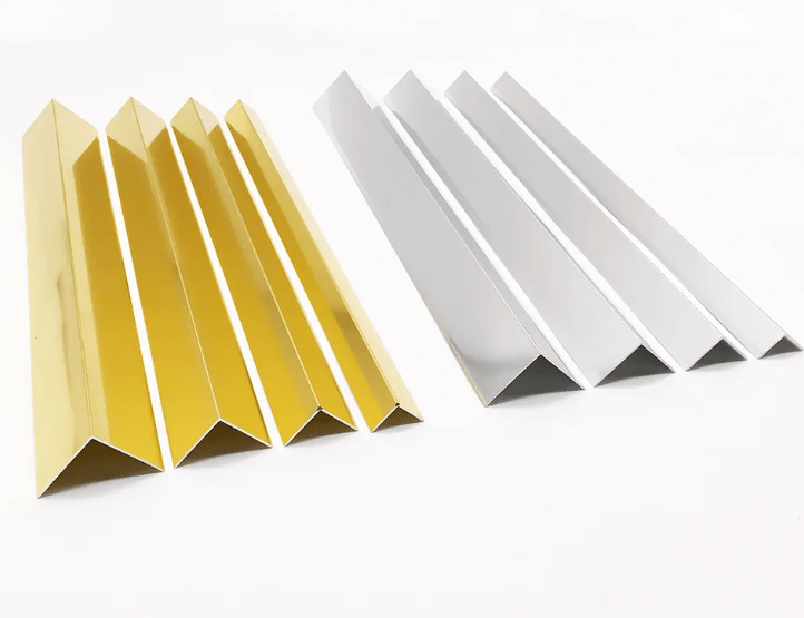 Gold and silver V-shaped aluminum wall panel trims arranged on a white background