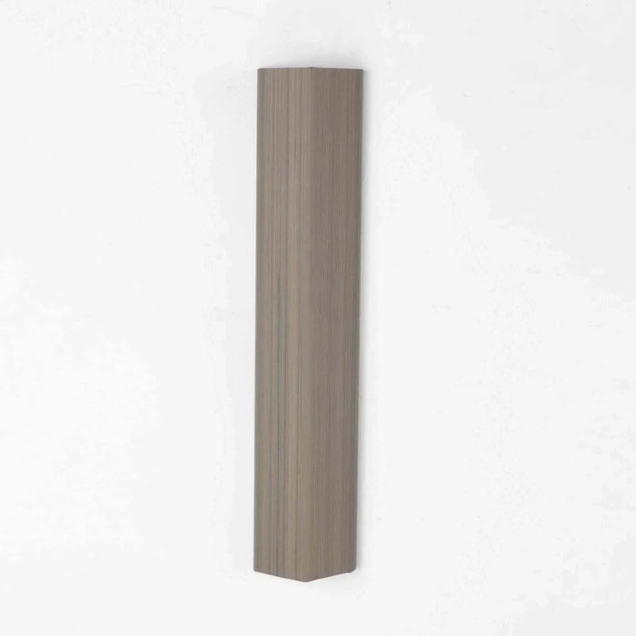 Light brown wood-plastic composite wall cladding with wood grain texture