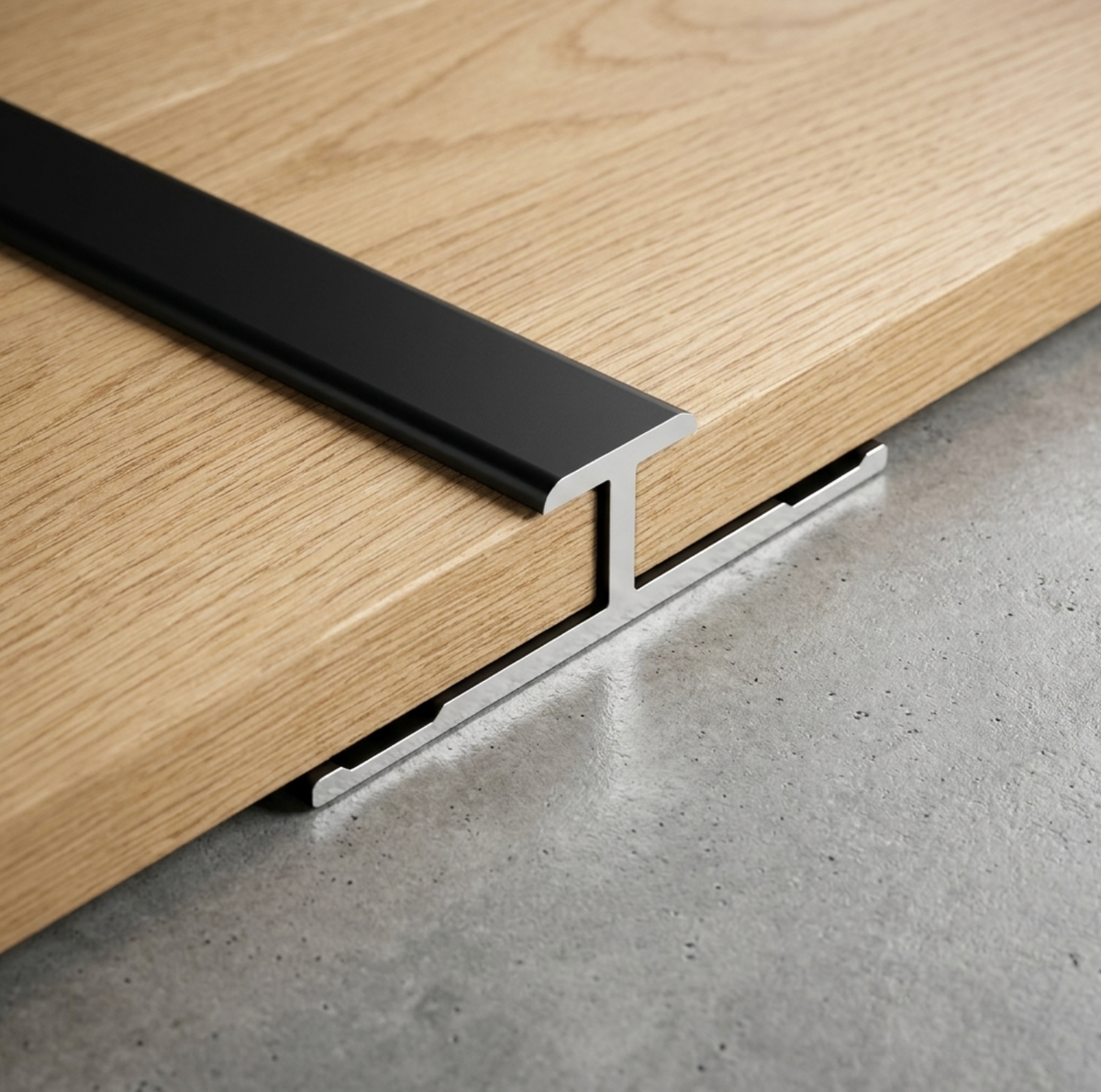 Black aluminum alloy H trim installed between two wood-look wall panels on a gray surface