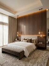 Walnut wood veneer panels forming a floor-to-ceiling accent wall behind a modern upholstered bed