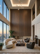 Tall walnut wood veneer panel accent wall in a double-height lounge with curved seating