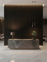 Walnut Ink Metallic 3D fluted feature wall behind a marble reception desk