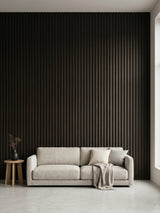 Minimalist living room with a full-height Walnut Ink Metallic 3D fluted wall behind a cream sofa