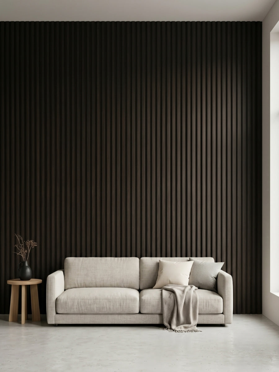 Minimalist living room with a full-height Walnut Ink Metallic 3D fluted wall behind a cream sofa