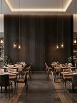 Restaurant dining room featuring a tall accent wall of Walnut Ink Metallic WPC fluted panels