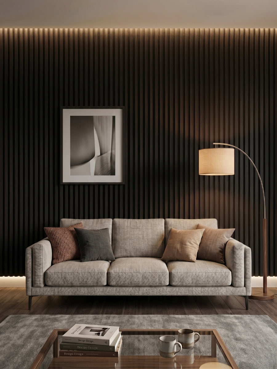 Living room with a gray sofa set against a Walnut Ink Metallic fluted wall panel backdrop