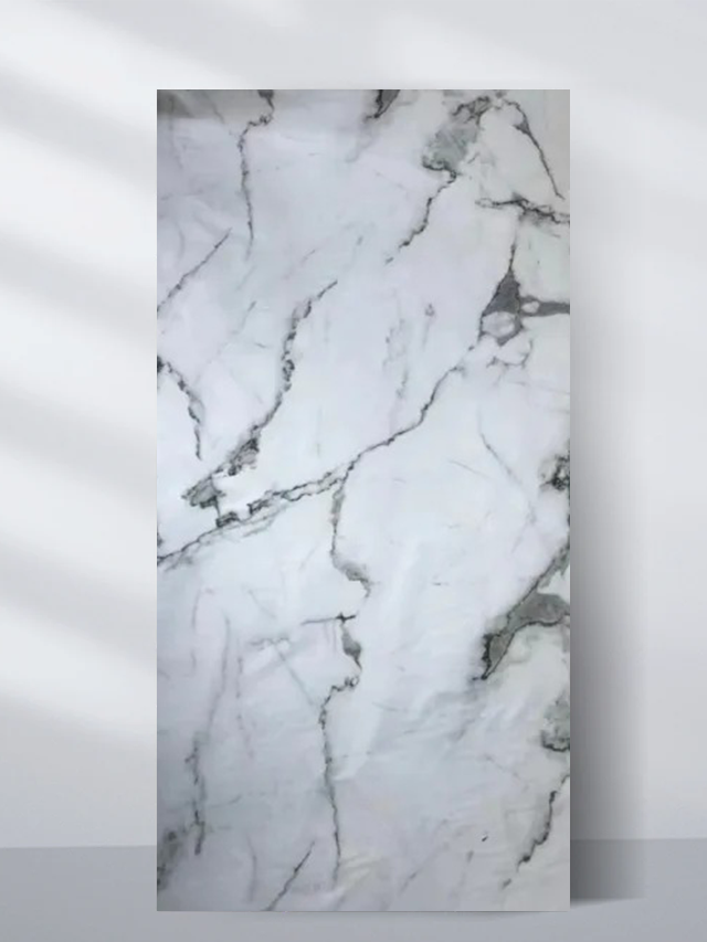 PVC marble sheet sample with soft gray veining and dark accents on white