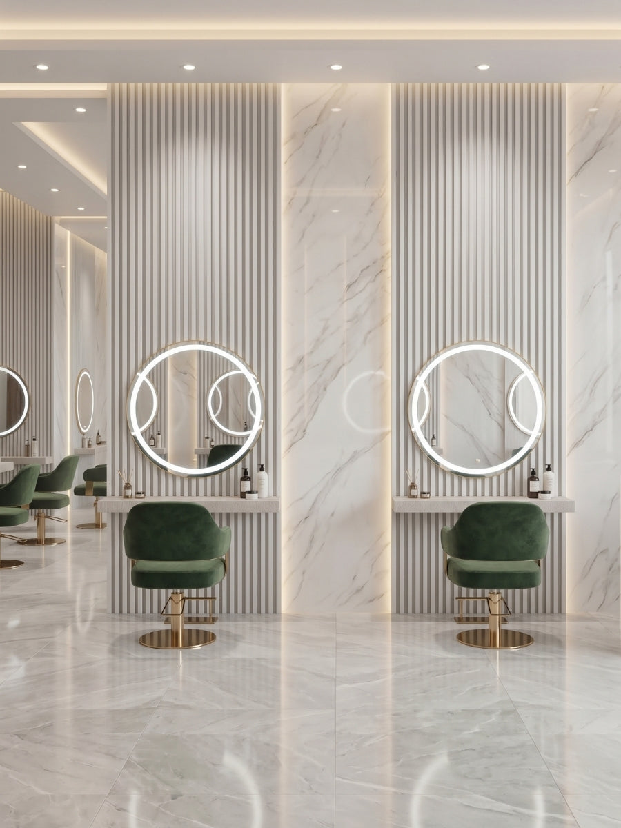 White brushed fluted wall panels framing round illuminated mirrors and green chairs in a salon
