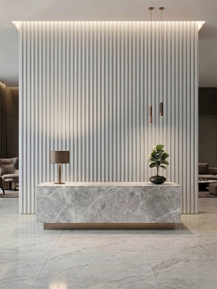 White brushed WPC fluted 3D wall panels installed behind a marble-look reception desk