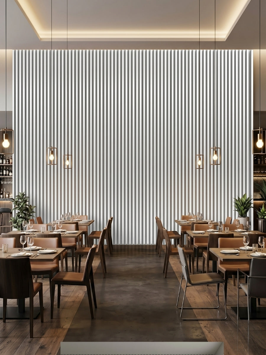 Floor-to-ceiling white brushed WPC fluted wall panels on a backlit restaurant feature wall