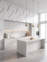 White marble-look PVC wall panels with gray veining installed in a bright modern kitchen with an island