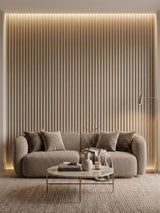 Floor-to-ceiling white oak WPC fluted wall panels framing a curved sofa