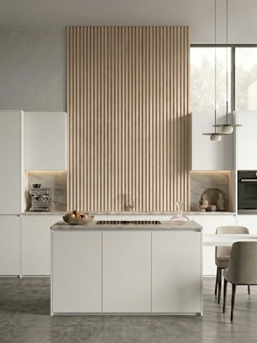 White oak WPC fluted wall panels creating a tall kitchen accent wall above the island
