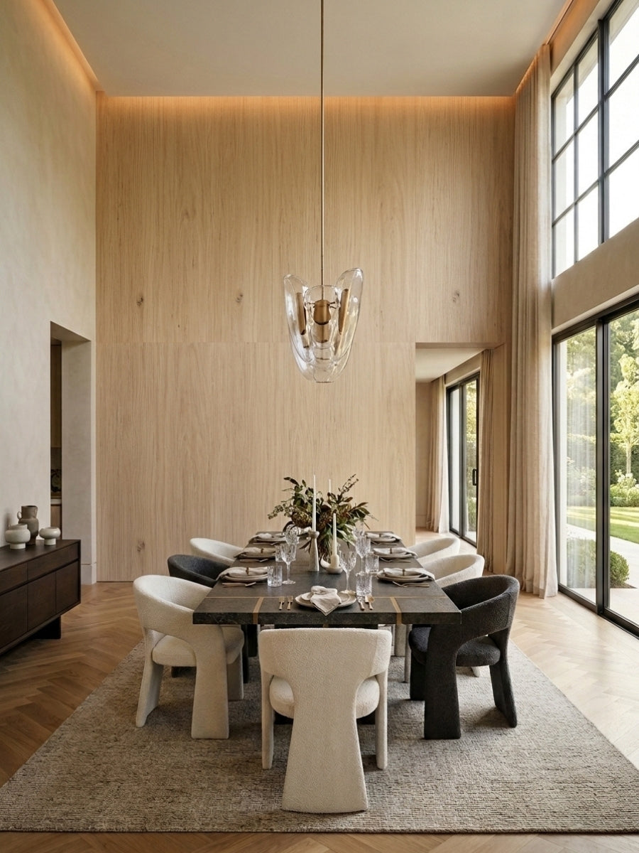 White oak veneer wall panels surrounding a formal dining area with tall windows and warm cove lighting