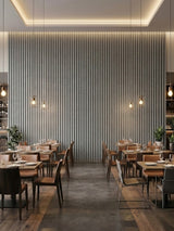Floor-to-ceiling white linen WPC fluted panels on a softly lit restaurant feature wall