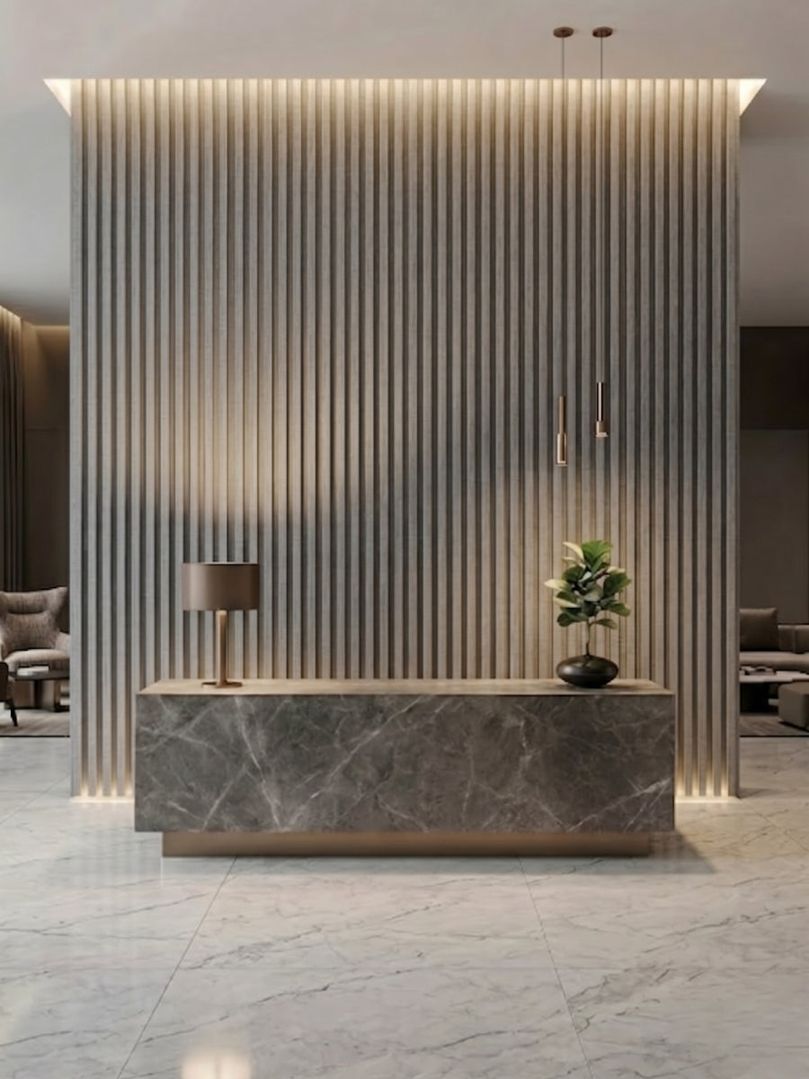White linen WPC fluted 3D panels installed as a floor-to-ceiling reception desk backdrop