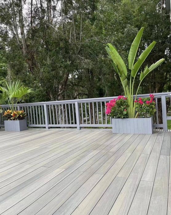 Light gray co-extruded composite decking with stylish gray railing