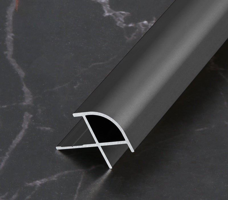 Dark gray 3mm aluminum outside corner trim with rounded face and exposed cross-section
