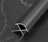 Black curved aluminum wall panel trim sample with its cross-section visible