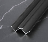 Black 3mm aluminum inside corner trim profile close-up on dark marble