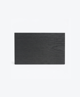 Black composite fence sample with horizontal wood-grain texture